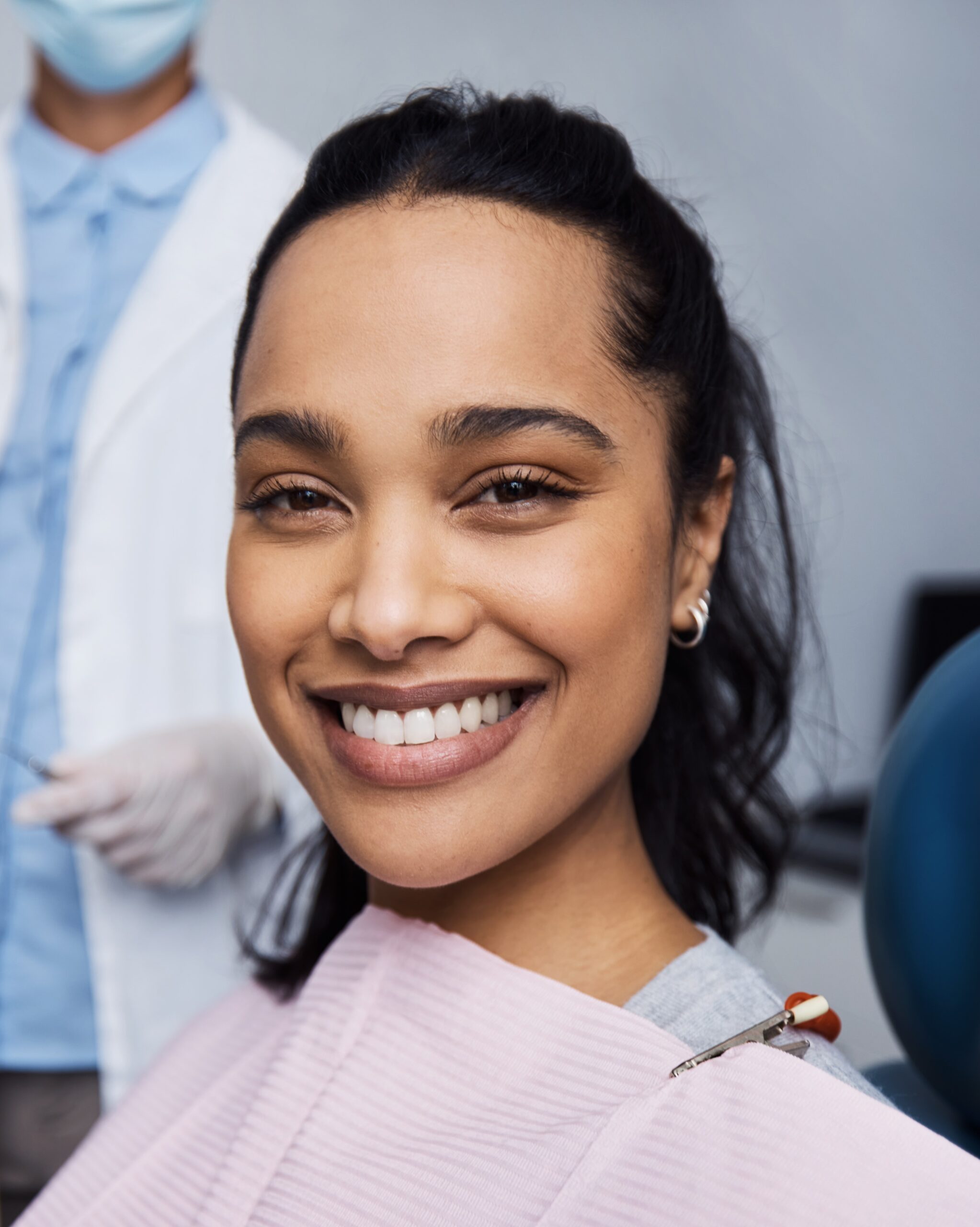 See what good dental health can do for your smile. Portrait of a young woman having dental work done on her teeth.